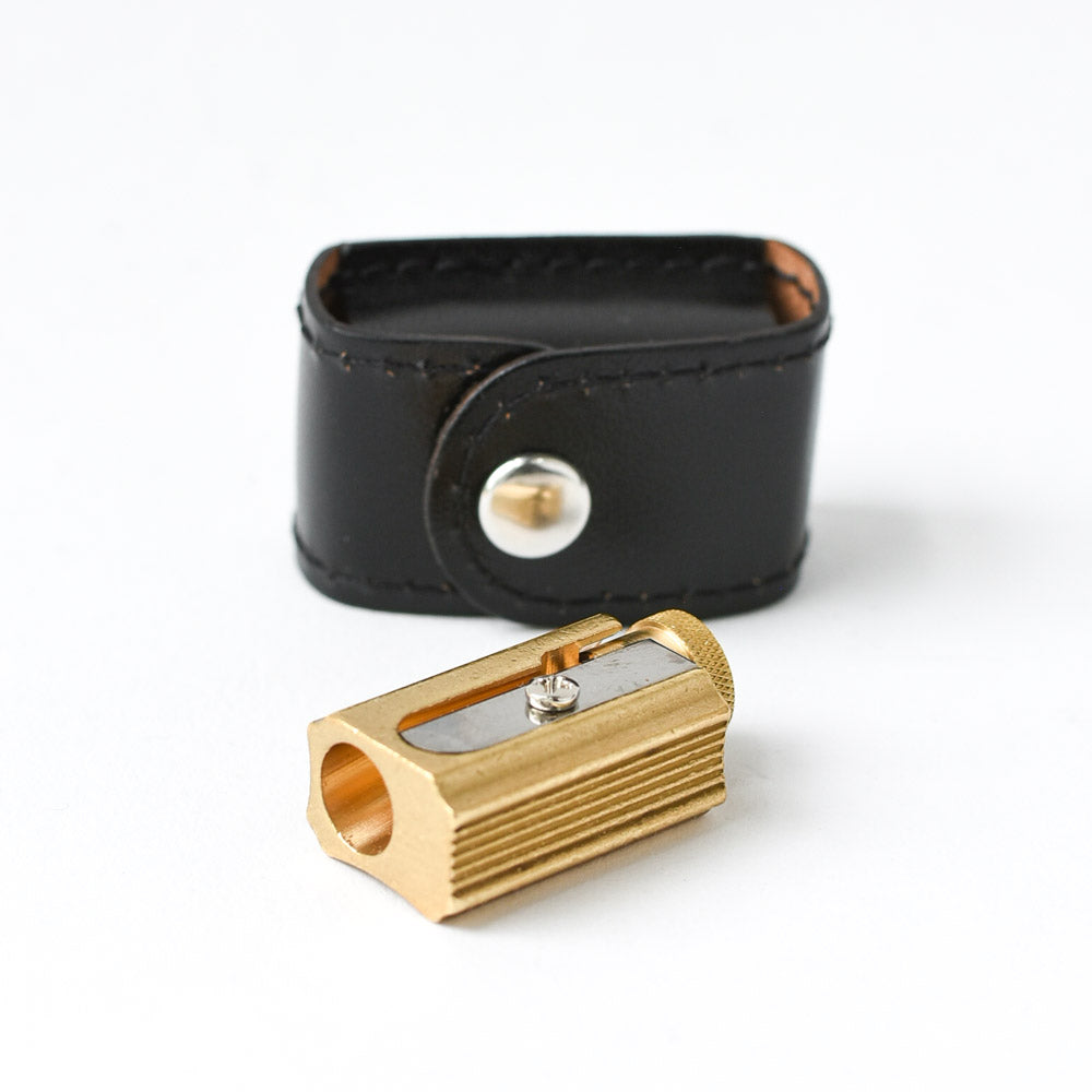 office supplies: brass pencil sharpener with black leather case | Brooklyn Haberdashery