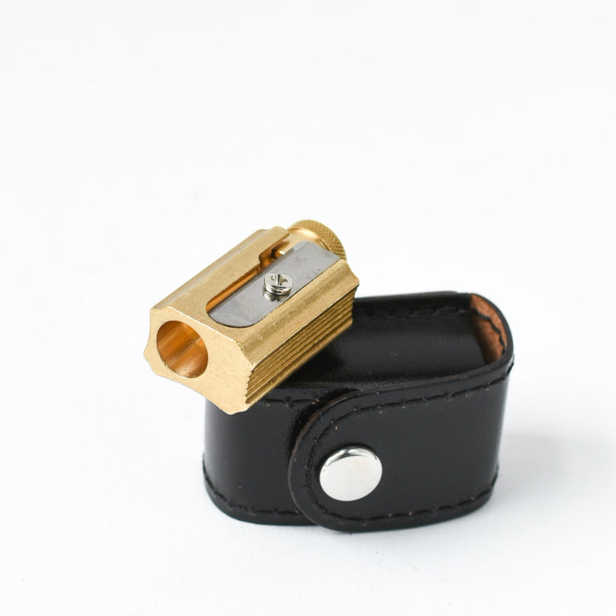 office supplies: brass pencil sharpener with black leather case | Brooklyn Haberdashery