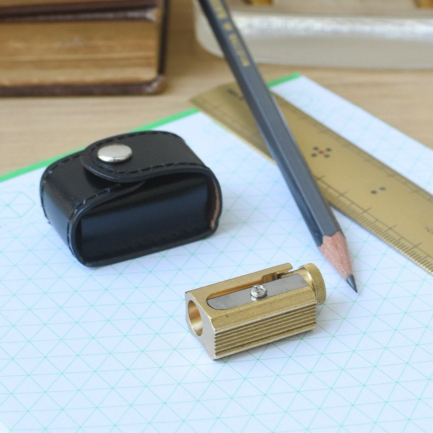 office supplies: brass pencil sharpener with black leather case | Brooklyn Haberdashery